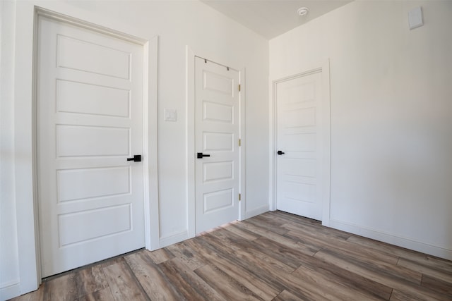 hallway featuring hardwood / wood-style floors