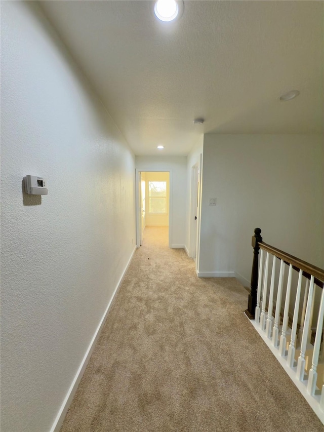 corridor with light carpet