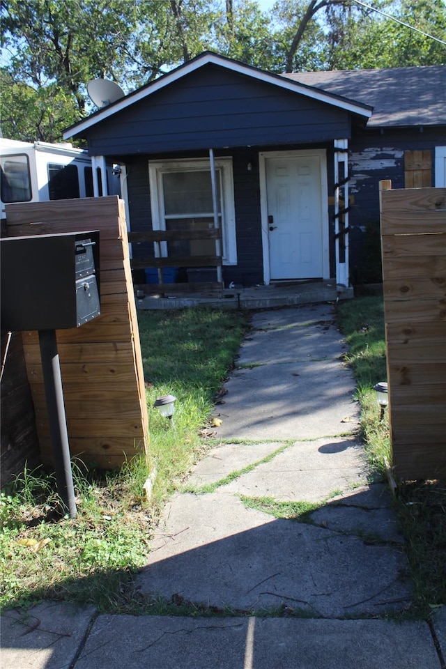 view of front of house with roof with shingles