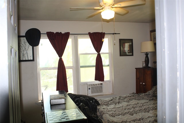 bedroom with ceiling fan and cooling unit