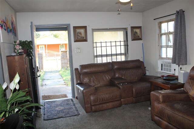 living room featuring cooling unit, ceiling fan, and carpet floors