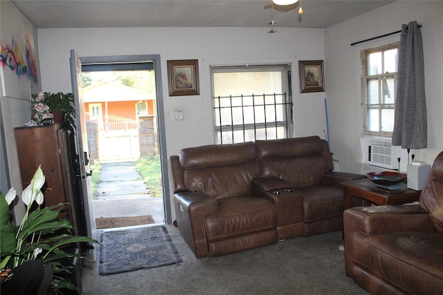 carpeted living area with cooling unit and ceiling fan