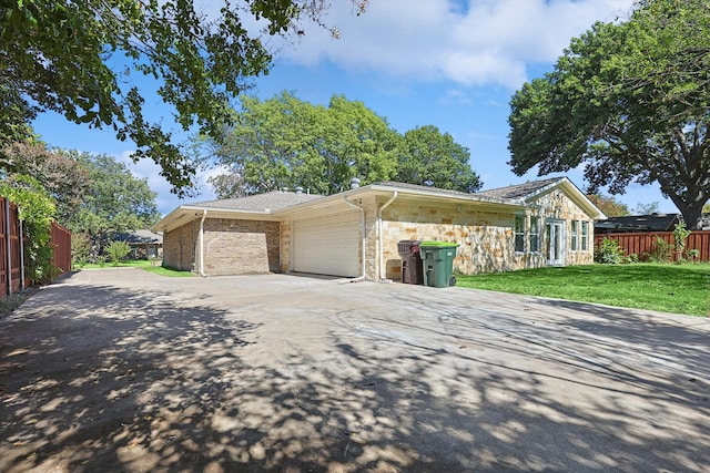 view of home's exterior with a yard and a garage