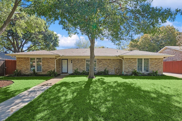 single story home with a front yard