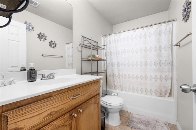 full bathroom with a textured ceiling, toilet, vanity, shower / tub combo with curtain, and tile patterned flooring