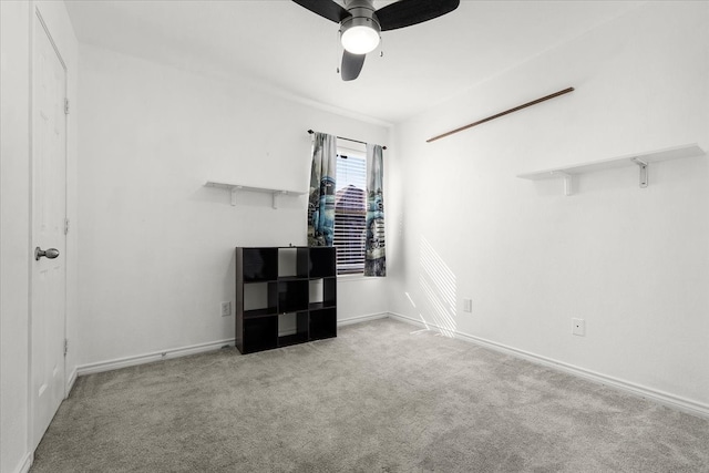 unfurnished bedroom with ceiling fan and light colored carpet