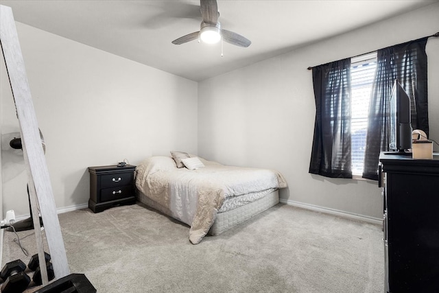 bedroom featuring light carpet and ceiling fan