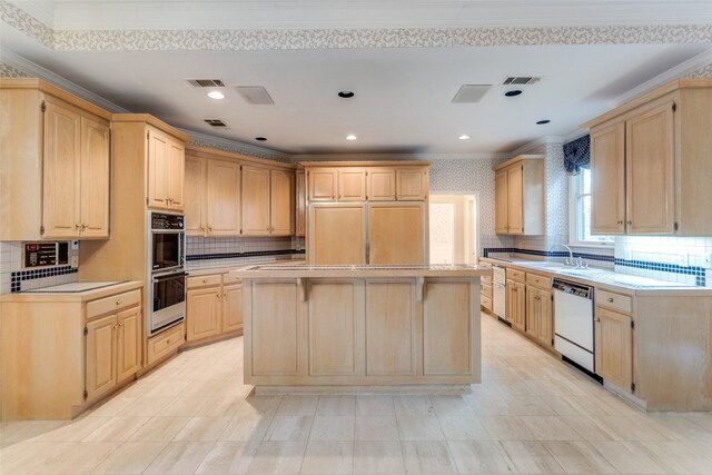 kitchen featuring electric cooktop, sink, tile counters, and light brown cabinetry