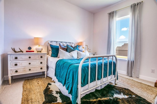 bedroom with carpet and baseboards