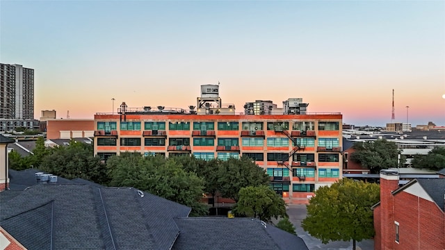 view of outdoor building at dusk