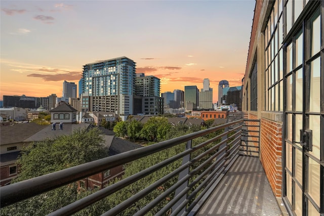 view of balcony at dusk