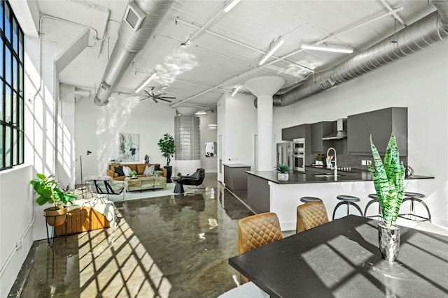 interior space with ceiling fan and sink