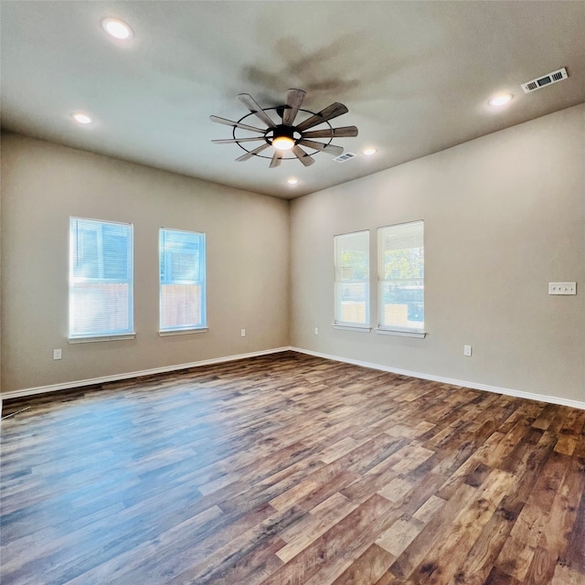 unfurnished room featuring hardwood / wood-style floors and ceiling fan