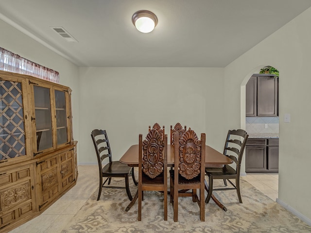 dining room with light tile patterned flooring