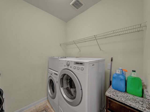 laundry room with washer and dryer