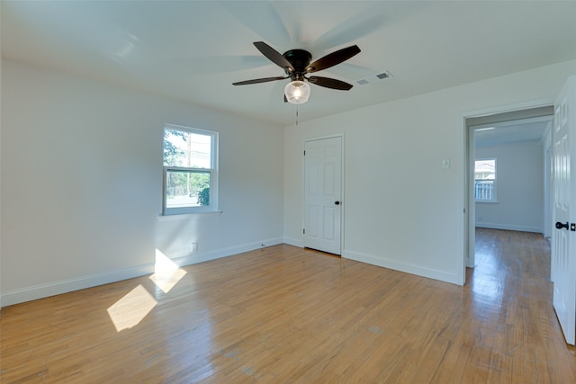 unfurnished room with ceiling fan and light hardwood / wood-style flooring