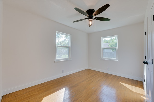 empty room featuring ceiling fan and light hardwood / wood-style flooring