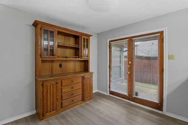 doorway to outside with light wood-type flooring