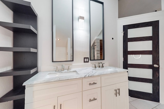 bathroom with vanity and tile patterned flooring