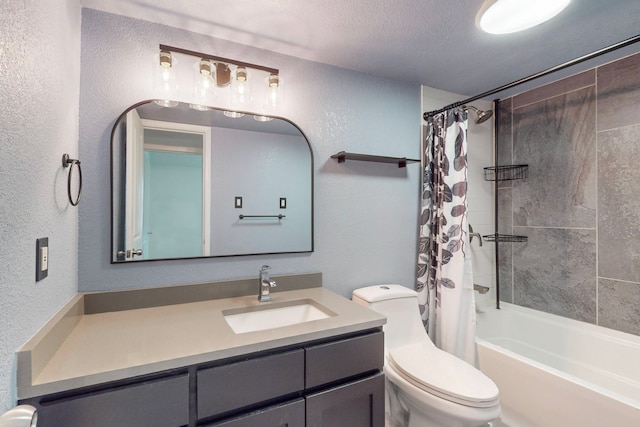 full bathroom featuring shower / tub combo with curtain, vanity, toilet, and a textured ceiling