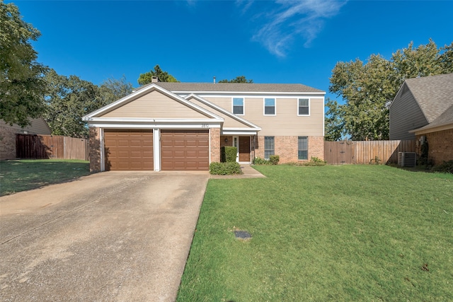 view of front of house featuring a front lawn, central AC unit, and a garage