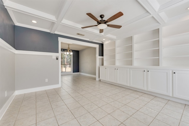 tiled spare room featuring beam ceiling, coffered ceiling, built in features, and ceiling fan with notable chandelier