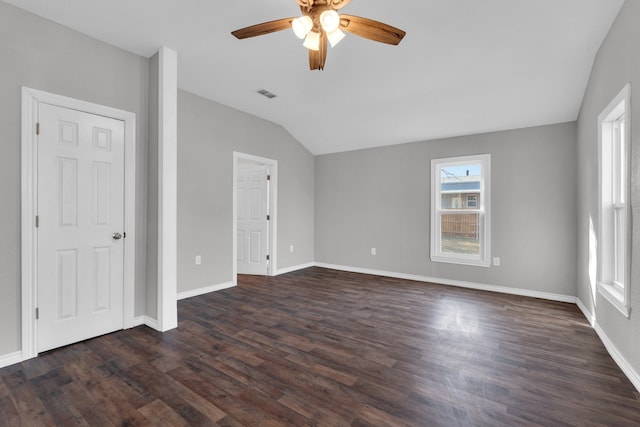 spare room with ceiling fan, lofted ceiling, and dark hardwood / wood-style flooring