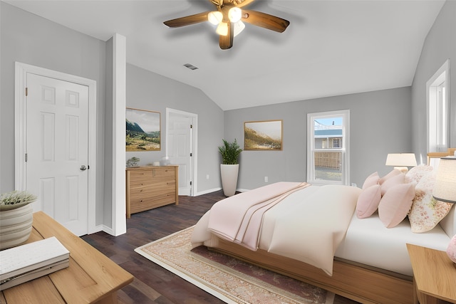 bedroom featuring vaulted ceiling, ceiling fan, and dark hardwood / wood-style flooring