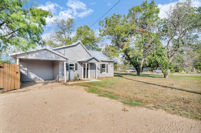 view of front facade featuring a garage and a front lawn