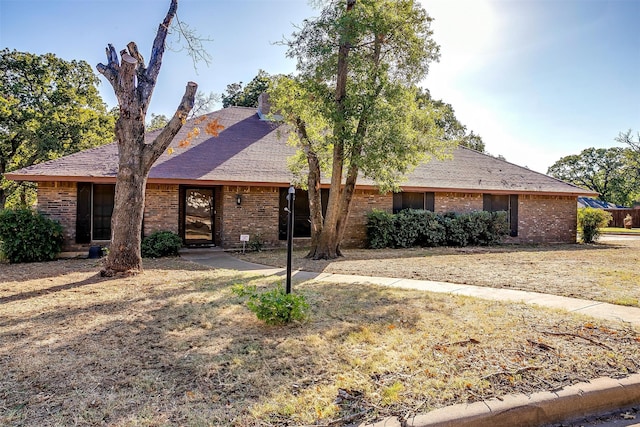 ranch-style home featuring a patio