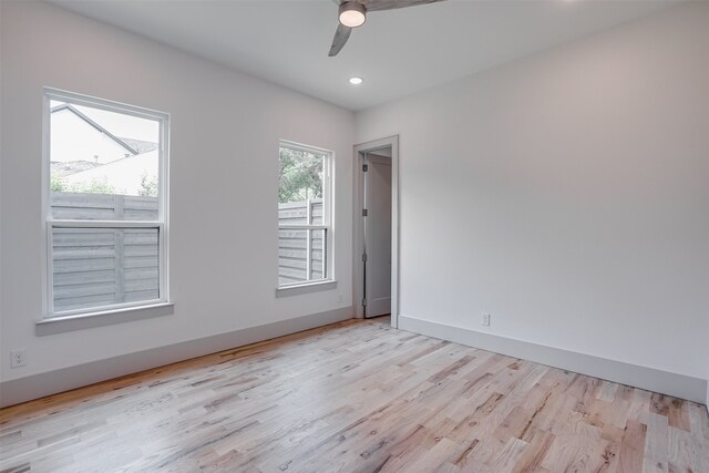 empty room featuring light hardwood / wood-style flooring and ceiling fan