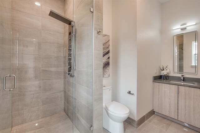 bathroom with toilet, an enclosed shower, vanity, and tile patterned floors