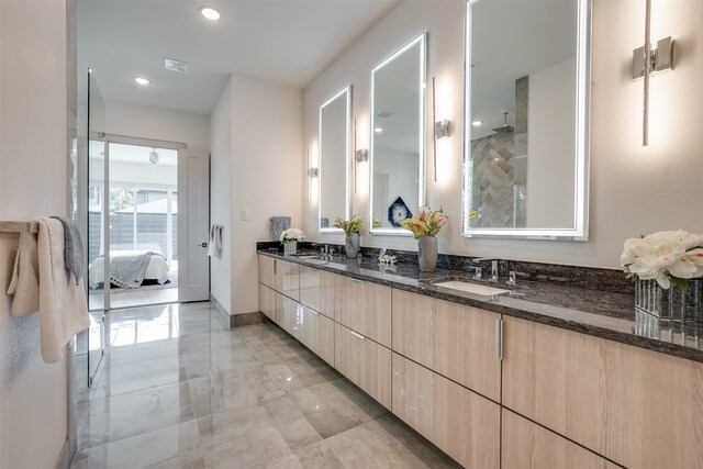 bathroom featuring vanity and a shower