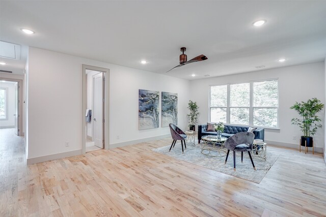 dining space with light wood-type flooring, a healthy amount of sunlight, and ceiling fan