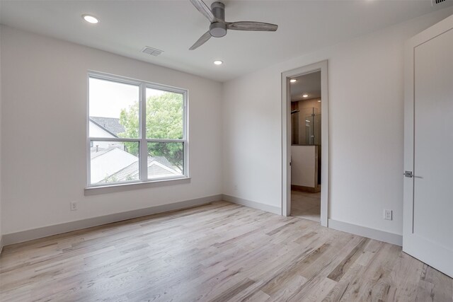 unfurnished bedroom with ceiling fan and light wood-type flooring