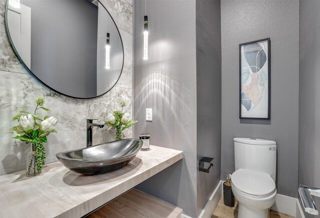 bathroom with toilet and vanity