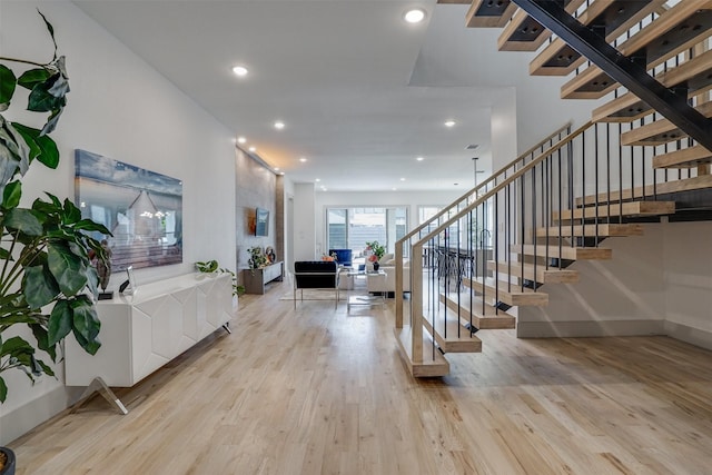3732 Valley Ridge Rd, Dallas, TX 75220 - entrance foyer featuring light wood-style floors, stairway, recessed lighting, and baseboards