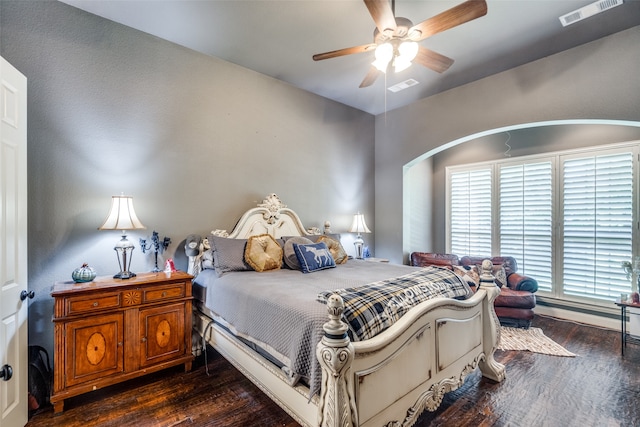 bedroom with dark hardwood / wood-style floors and ceiling fan