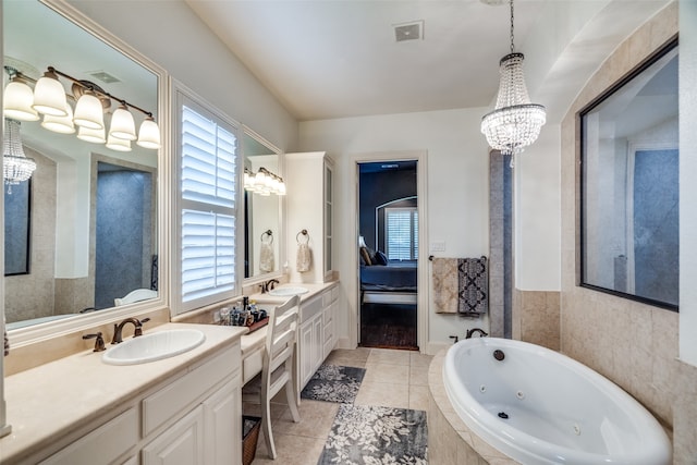 bathroom featuring vanity, tiled bath, and tile patterned floors