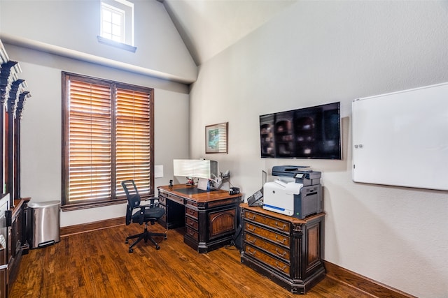 office with high vaulted ceiling and hardwood / wood-style flooring