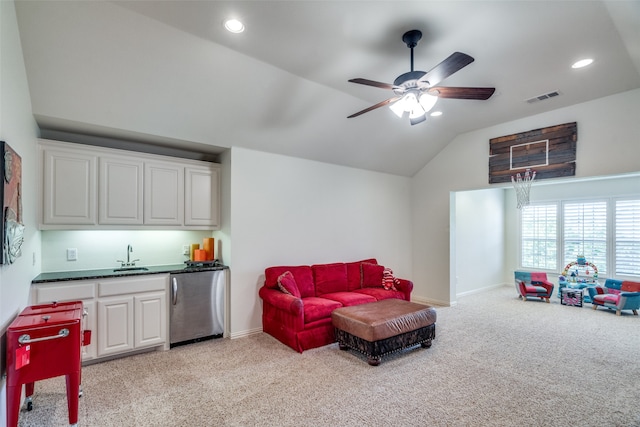 interior space featuring lofted ceiling, indoor wet bar, and ceiling fan