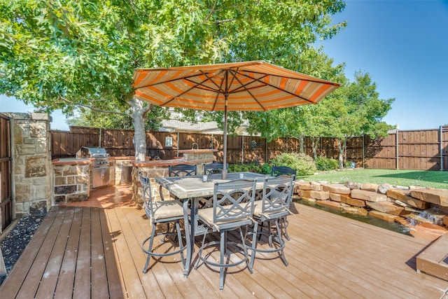 deck with an outdoor kitchen and grilling area