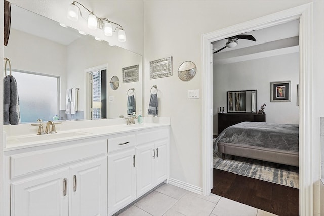 bathroom featuring ceiling fan, vanity, and tile patterned floors