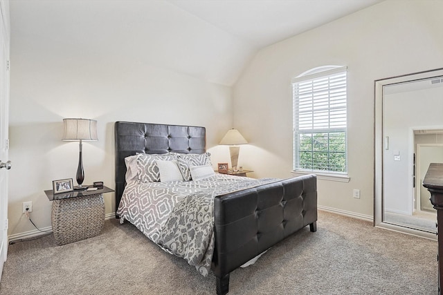 bedroom with carpet and vaulted ceiling