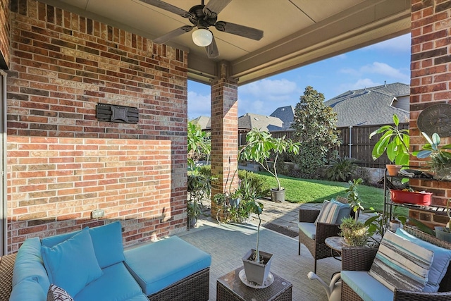 view of patio / terrace with ceiling fan and an outdoor living space