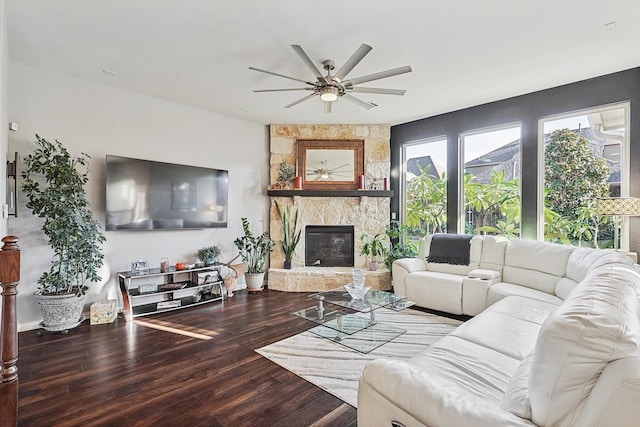 living room with a fireplace, hardwood / wood-style floors, and ceiling fan