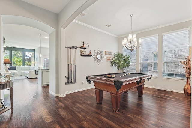 playroom featuring dark hardwood / wood-style flooring, ornamental molding, billiards, and ceiling fan with notable chandelier