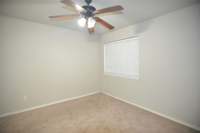 spare room with light carpet and ceiling fan