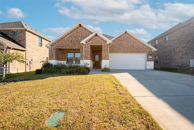 view of front of home featuring a garage and a front lawn