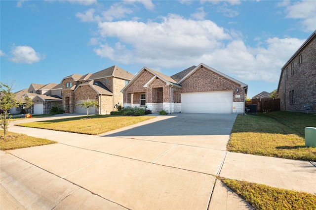 view of front facade with a front yard and a garage